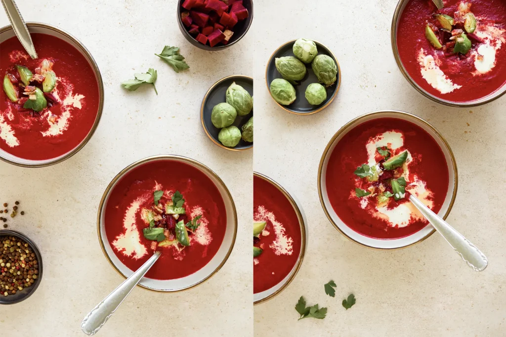 Leuchtend rote Rote-Bete-Suppe in einer Schale, garniert mit frischen Kräutern und einem Klecks Joghurt – ein farbenfroher und gesunder Wintergenuss.